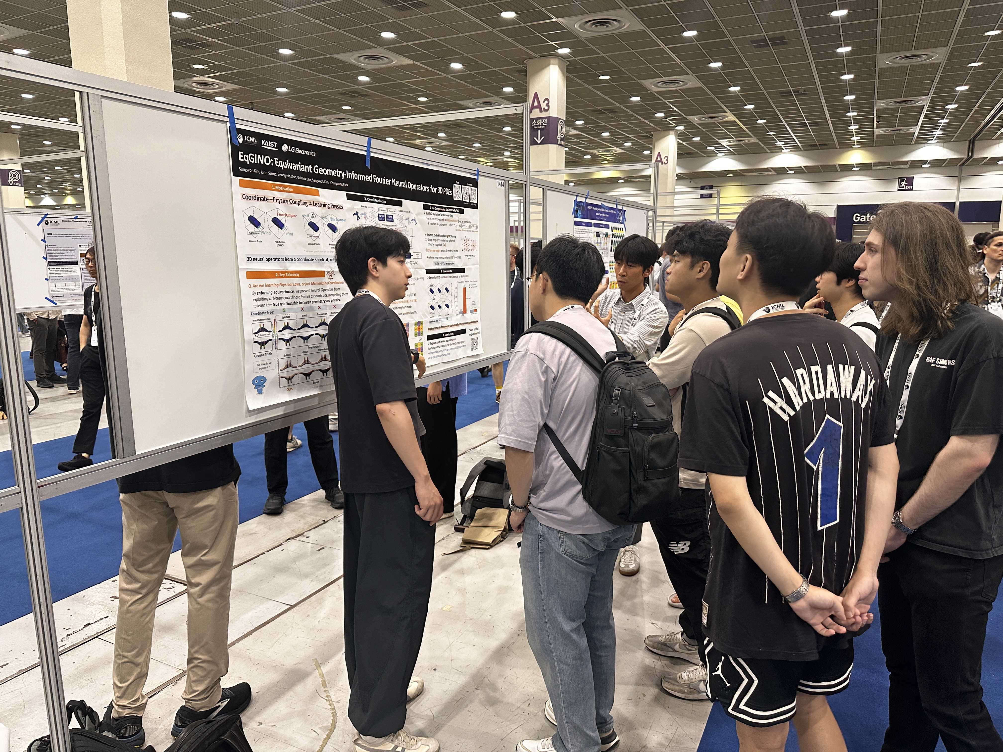 Sungwon and Juho give a poster presentation